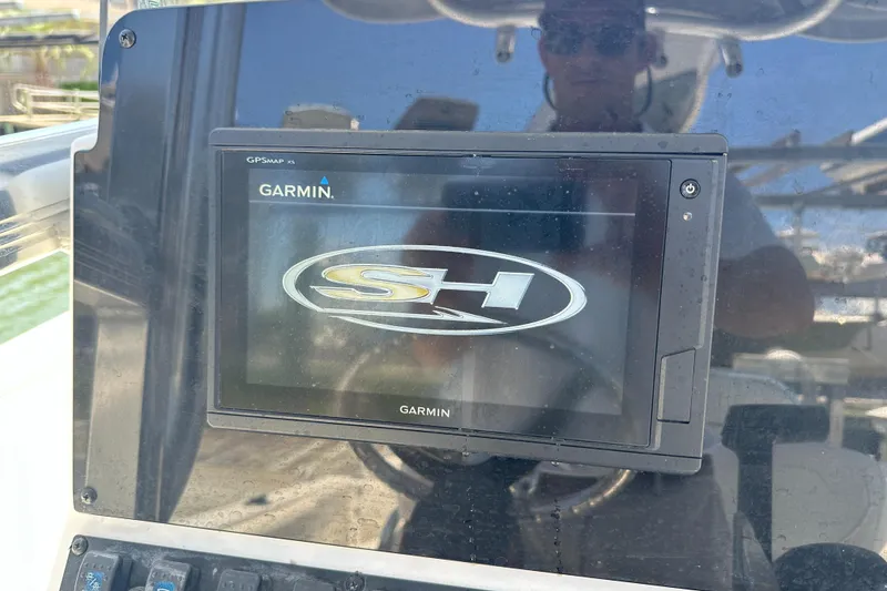 Slide: The Image of Garmin GPS display on 2019 Sea Hunt Ultra 225 boat dashboard. - 13