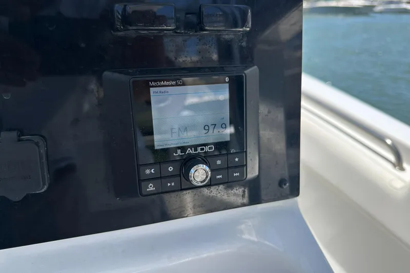 Slide: The Image of JL Audio MediaMaster 50 on 2019 Sea Hunt Ultra 225 boat dashboard. - 14