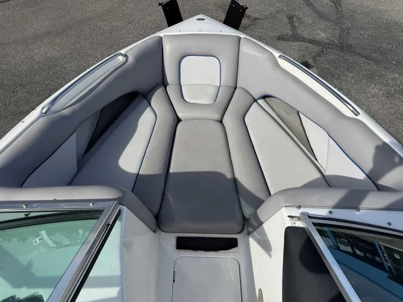 Slide: The Image of 2005 Centurion Elite boat interior with gray seating and open windshield. - 11
