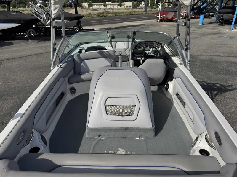 Slide: The Image of 2005 Centurion Elite boat interior with gray seating and steering wheel. - 7