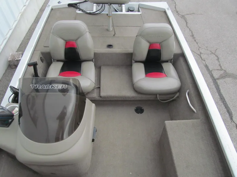 Slide: The Image of 1999 Tracker PRO TEAM 175 SE boat interior with dual seats and steering console. - 11