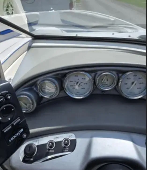 Slide: The Image of Dashboard of a 2006 Bayliner 205 BR boat with gauges and controls. - 11