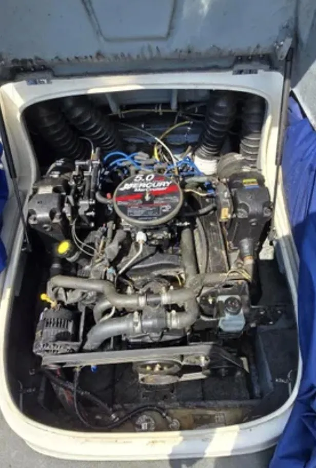 Slide: The Image of Engine compartment of a 2006 Bayliner 205 BR boat with a 5.0 Mercury engine. - 16