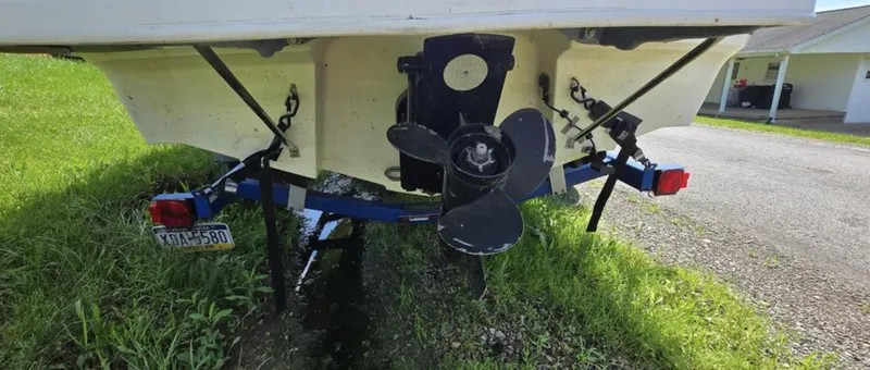 Slide: The Image of Rear view of a 2006 Bayliner 205 BR boat on a trailer, showing the propeller. - 4