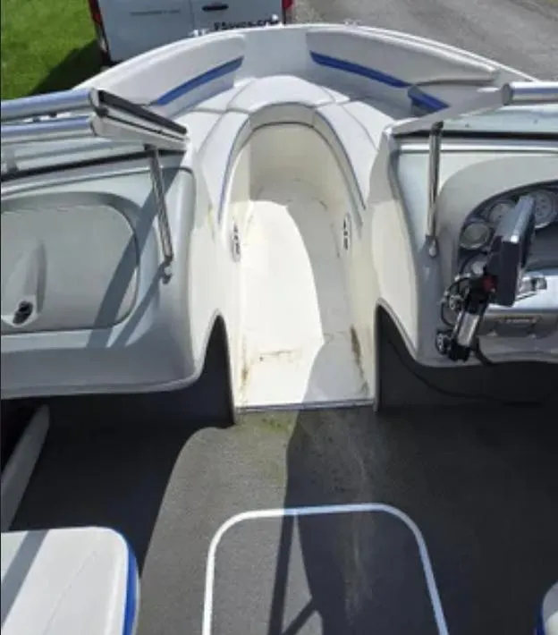 Slide: The Image of 2006 Bayliner 205 BR boat interior with seating and steering console. - 7