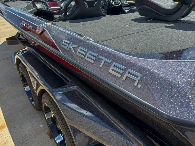Slide: The Image of 2023 Skeeter FXR 21 Limited boat with sleek design and metallic finish. - 8