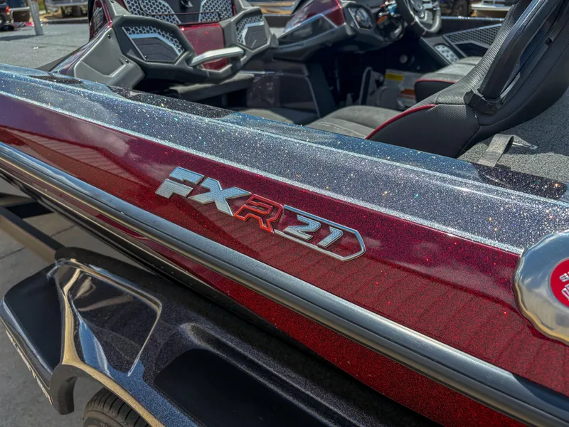Slide: The Image of 2023 Skeeter FXR 21 Limited boat, close-up of metallic red exterior detailing. - 9