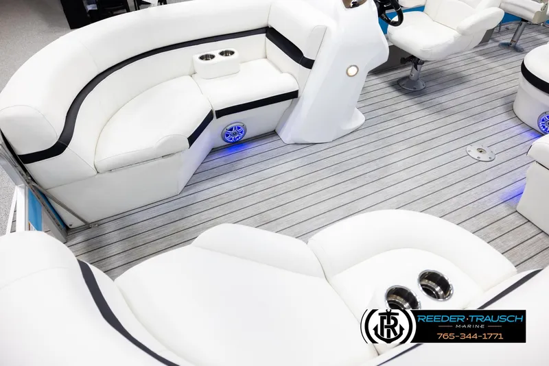 Slide: The Image of Luxurious interior of 2020 Trifecta 20 RFC CS pontoon boat with white seating and wood flooring. - 10