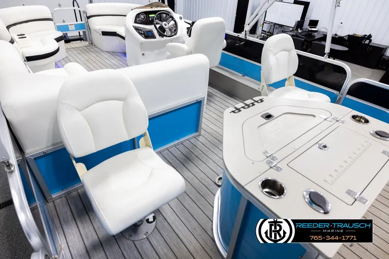 Slide: The Image of 2020 Trifecta 20 RFC CS pontoon boat interior with white seating and control panel. - 11