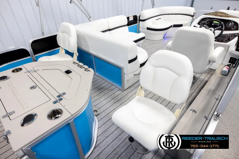 Slide: The Image of Interior of 2020 Trifecta 20 RFC CS pontoon boat with white seating and blue accents. - 12
