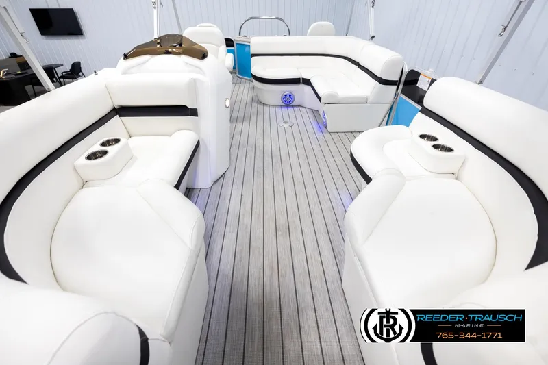 Slide: The Image of Luxurious 2020 Trifecta 20 RFC CS pontoon boat interior with white seating and wood flooring. - 13