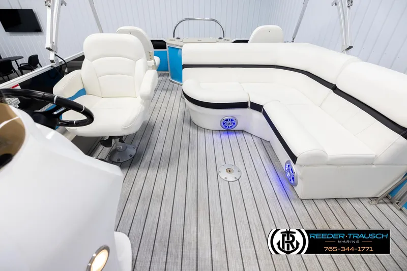 Slide: The Image of Luxurious interior of 2020 Trifecta 20 RFC CS pontoon boat with white seating. - 14