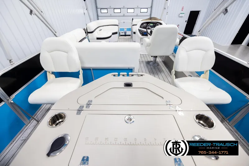 Slide: The Image of Interior of 2020 Trifecta 20 RFC CS pontoon boat with white seating and control panel. - 16