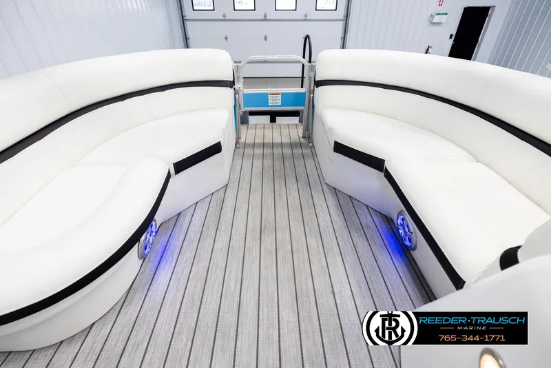 Slide: The Image of 2020 Trifecta 20 RFC CS pontoon boat interior with white seating and blue LED lights. - 18