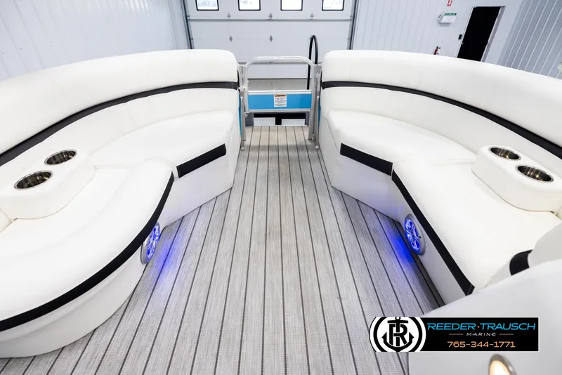 Slide: The Image of Luxurious interior of 2020 Trifecta 20 RFC CS pontoon boat with white seating and cup holders. - 19