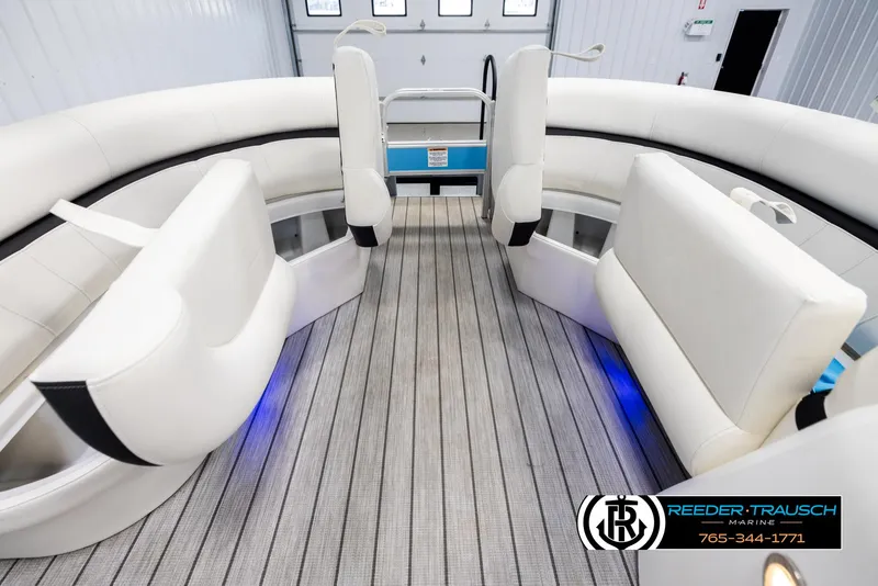 Slide: The Image of 2020 Trifecta 20 RFC CS pontoon boat interior with white seating and wood-style flooring. - 20