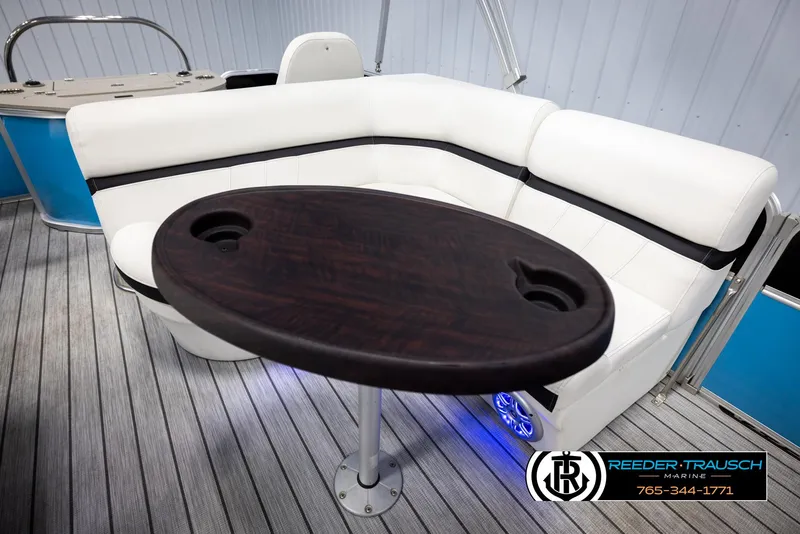 Slide: The Image of Luxurious seating area on 2020 Trifecta 20 RFC CS pontoon boat with wooden table. - 22