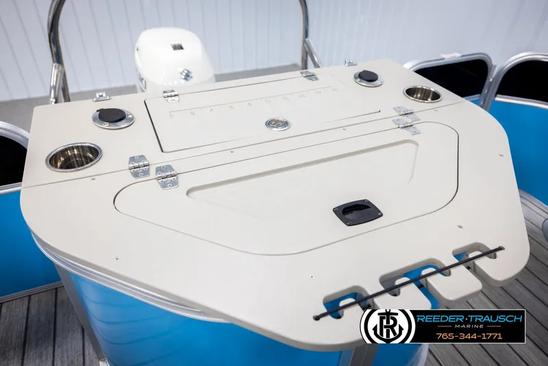 Slide: The Image of Control panel of a 2020 Trifecta 20 RFC CS boat with cup holders and storage. - 24