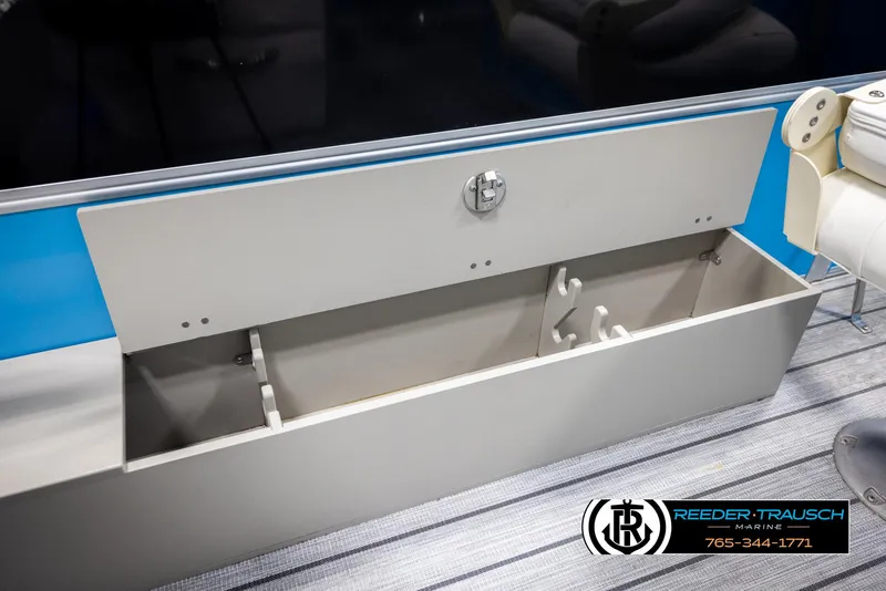 Slide: The Image of Open storage compartment on a 2020 Trifecta 20 RFC CS boat, featuring a secure latch. - 30