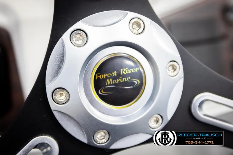 Slide: The Image of Close-up of a 2020 Trifecta 20 RFC CS steering wheel with Forest River Marine logo. - 33