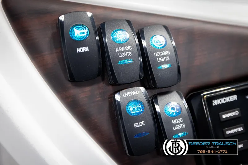 Slide: The Image of Control panel of 2020 Trifecta 20 RFC CS boat with labeled switches and Kicker audio system. - 35