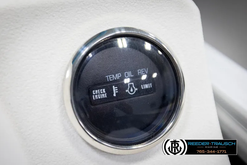 Slide: The Image of Close-up of a 2020 Trifecta 20 RFC CS gauge panel with engine indicators. - 39