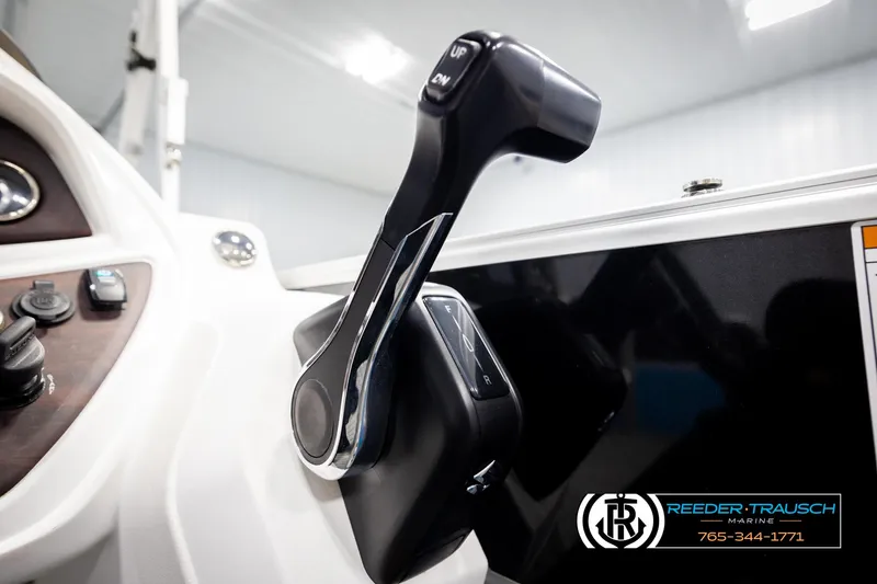 Slide: The Image of Close-up of 2020 Trifecta 20 RFC CS boat throttle control in a marine setting. - 41