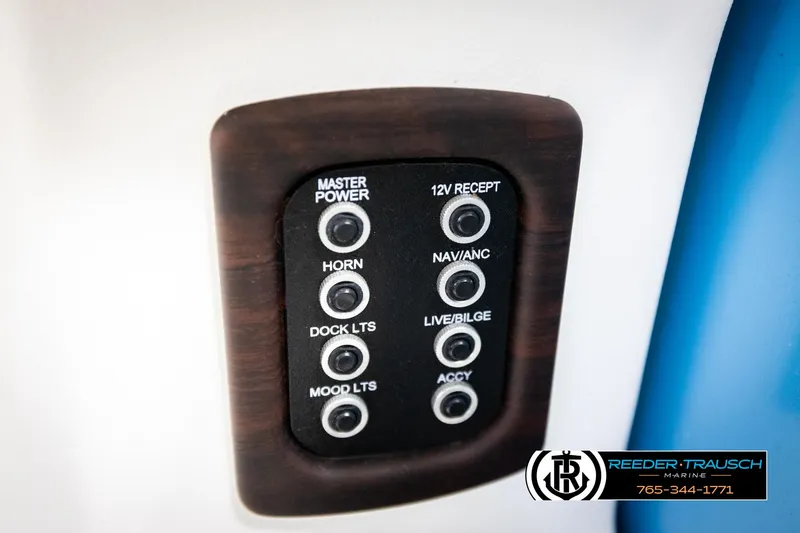 Slide: The Image of Control panel of a 2020 Trifecta 20 RFC CS boat with various switches. - 42