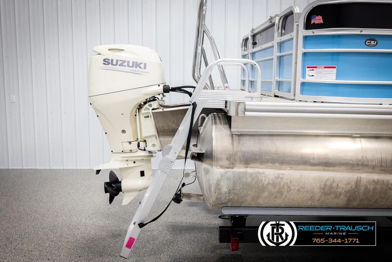 Slide: The Image of 2020 Trifecta 20 RFC CS pontoon boat with Suzuki outboard motor in showroom. - 49