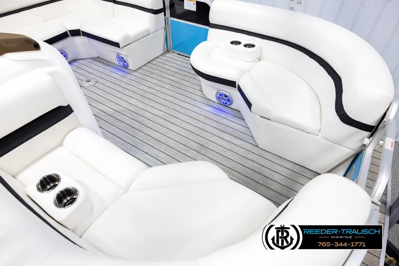 Slide: The Image of Luxurious seating on 2020 Trifecta 20 RFC CS pontoon boat with cup holders and blue lighting. - 9