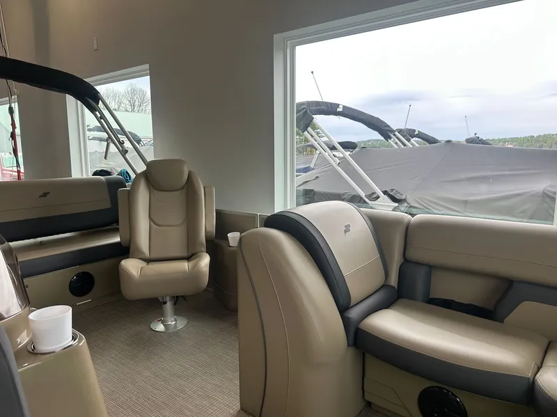 Slide: The Image of Interior of Starcraft EX 22 R boat, 2026 model, featuring beige leather seating. - 11