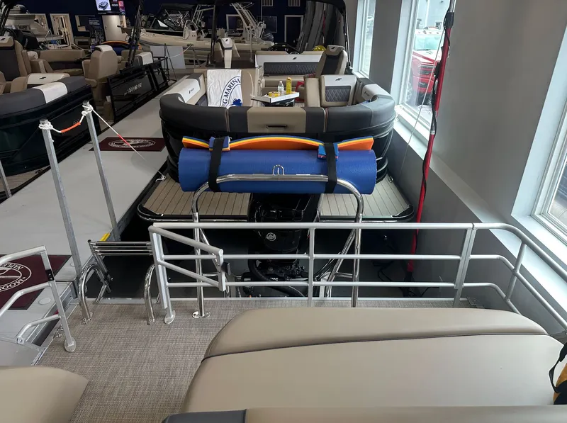 Slide: The Image of Starcraft EX 22 R 2026 pontoon boat in showroom. - 7