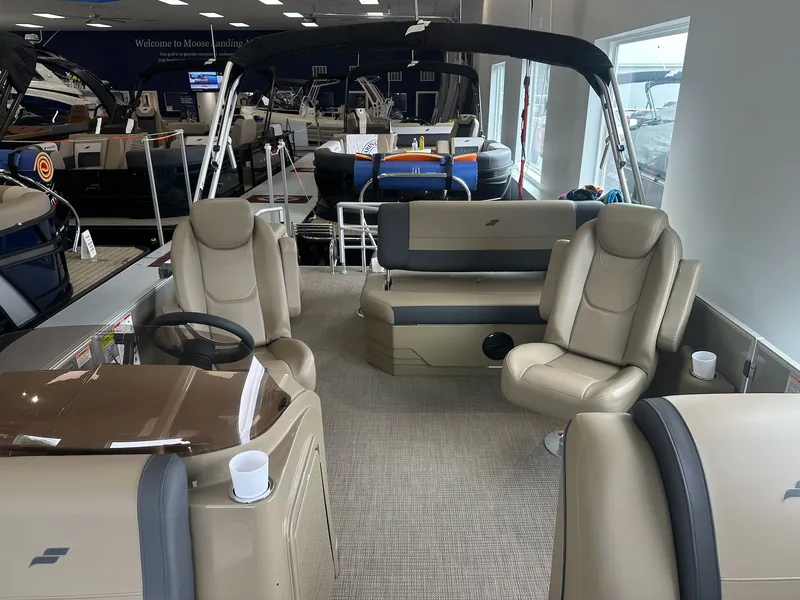 Slide: The Image of Interior of 2026 Starcraft EX 22 R pontoon boat in showroom. - 8