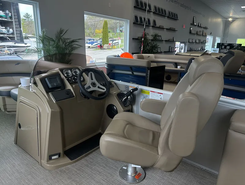 Slide: The Image of Interior of 2026 Starcraft EX 22 R with helm console and seating. - 9