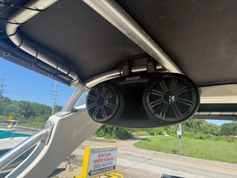 Slide: The Image of Kicker speakers on 2011 Sea Ray 250 SLX boat, outdoor setting. - 22