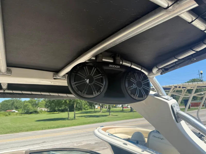 Slide: The Image of Speakers installed on a 2011 Sea Ray 250 SLX boat, under a shaded canopy. - 23