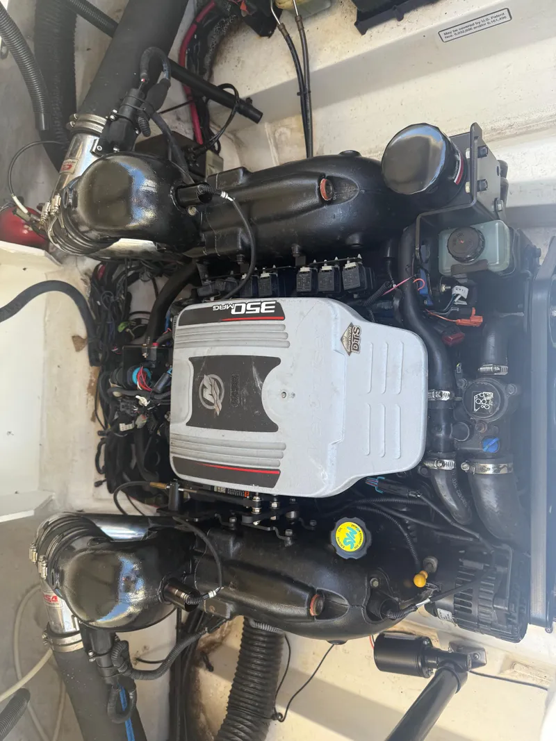 Slide: The Image of Engine of a 2011 Sea Ray 250 SLX boat, showcasing detailed components and wiring. - 27