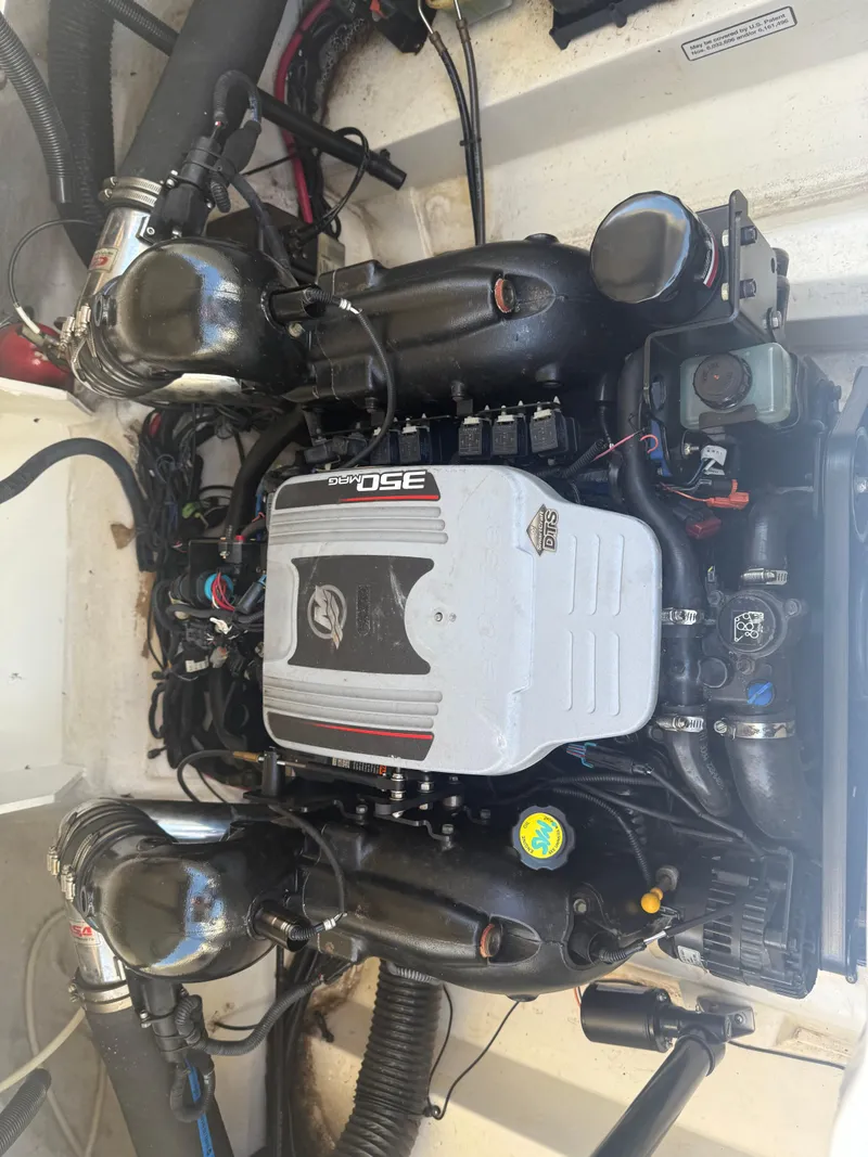 Slide: The Image of Engine of a 2011 Sea Ray 250 SLX boat, showcasing detailed components. - 28