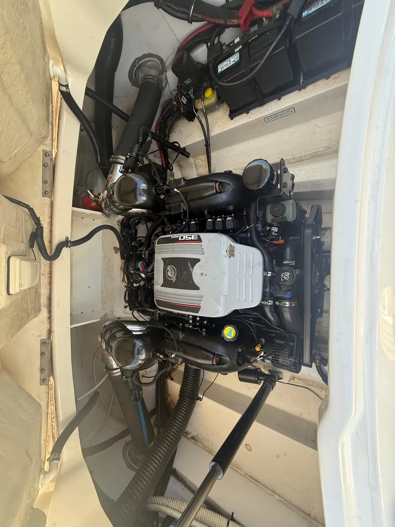 Slide: The Image of Engine compartment of a 2011 Sea Ray 250 SLX boat, showcasing detailed components. - 29