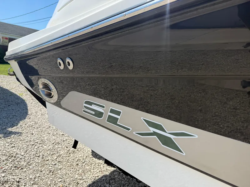 Slide: The Image of 2011 Sea Ray 250 SLX boat exterior with sleek design and logo detail. - 3
