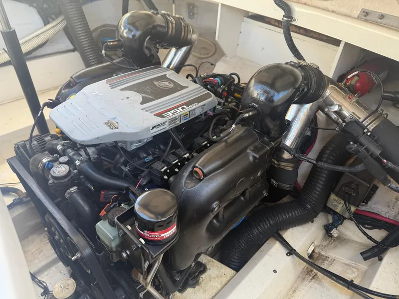 Slide: The Image of Engine of 2011 Sea Ray 250 SLX boat, featuring a 350 MAG motor. - 30