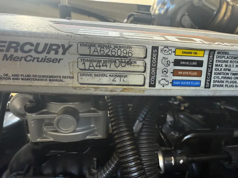 Slide: The Image of Engine compartment of a 2011 Sea Ray 250 SLX with Mercury MerCruiser details. - 31