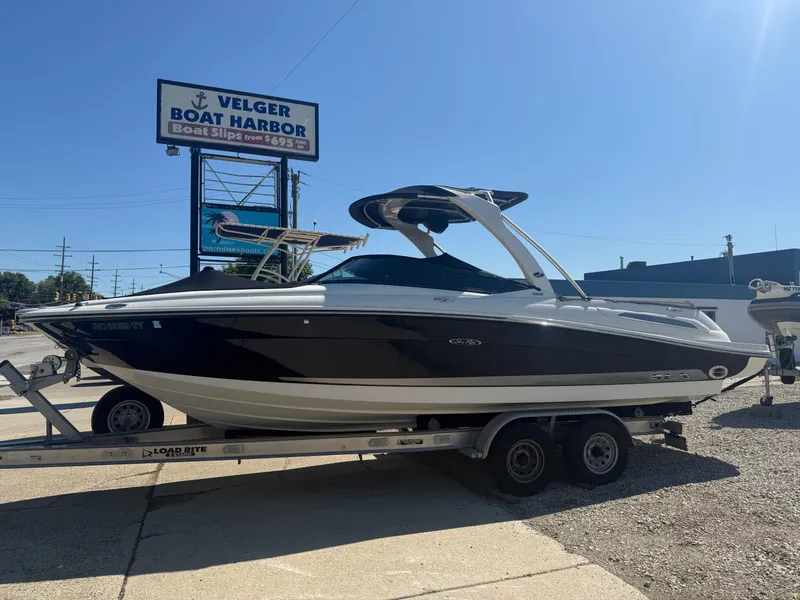 Slide: The Image of 2011 Sea Ray 250 SLX boat on trailer at Velger Boat Harbor. - 33