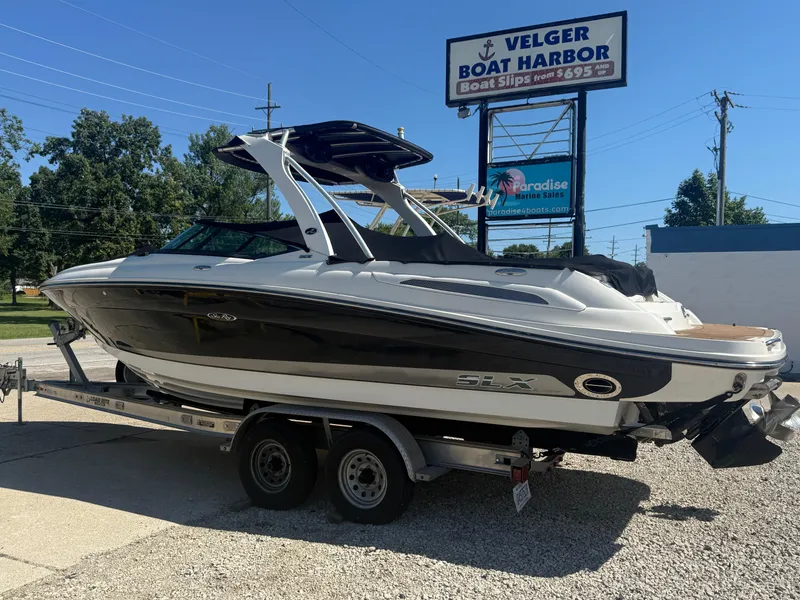 Slide: The Image of 2011 Sea Ray 250 SLX boat on trailer at Velger Boat Harbor. - 36