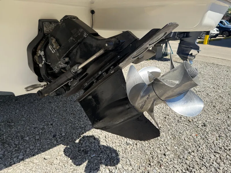 Slide: The Image of Close-up of a 2011 Sea Ray 250 SLX boat propeller on gravel surface. - 38