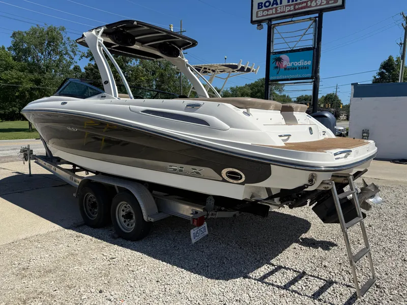 Slide: The Image of 2011 Sea Ray 250 SLX boat on trailer at Paradise Marine Sales. - 39