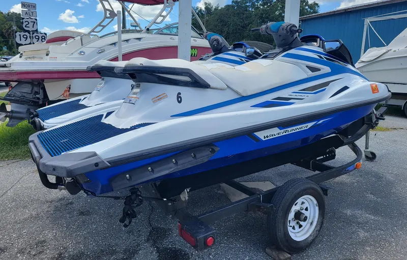 Slide: The Image of 2020 Yamaha WaveRunner VX on trailer, parked near boats, under clear sky. - 3