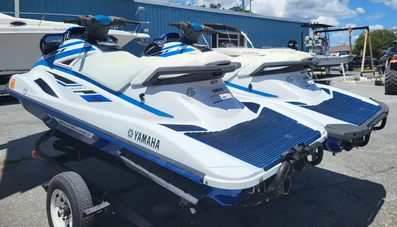 Slide: The Image of 2020 Yamaha WaveRunner VX jet skis on a trailer, parked outdoors. - 5