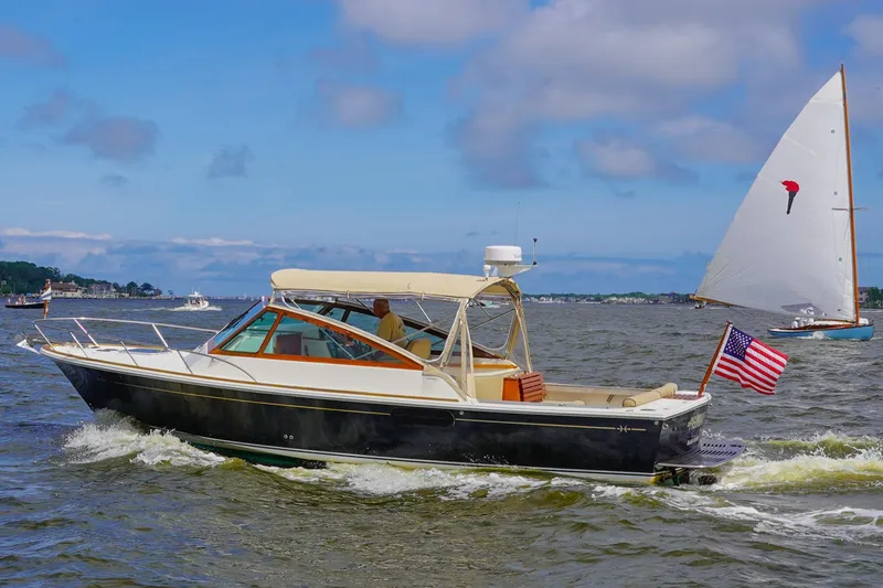 Slide: The Image of 2009 Hunt Yachts Harrier 29 cruising on a sunny day with American flag. - 1