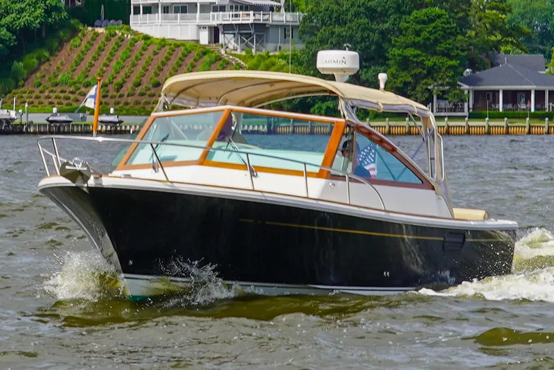 Slide: The Image of 2009 Hunt Yachts Harrier 29 cruising on a scenic waterway. - 3